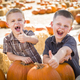 Two Boys Having Fun at the Pumpkin Patch on a Fall Day. - PhotoDune Item for Sale