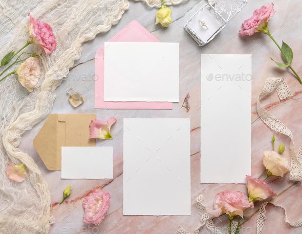 Wedding Wedding stationery set with envelope laying on a marble table
