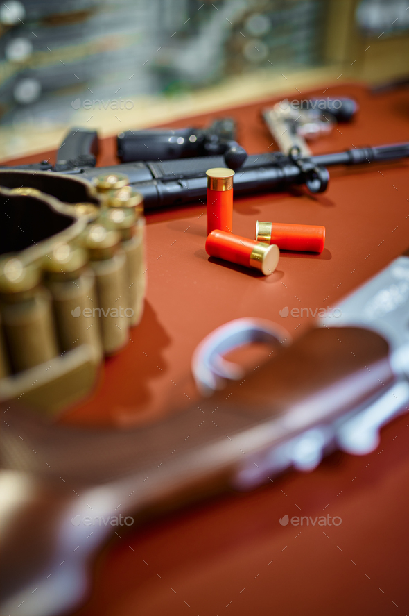 Automatic and hunting rifles in gun store closeup