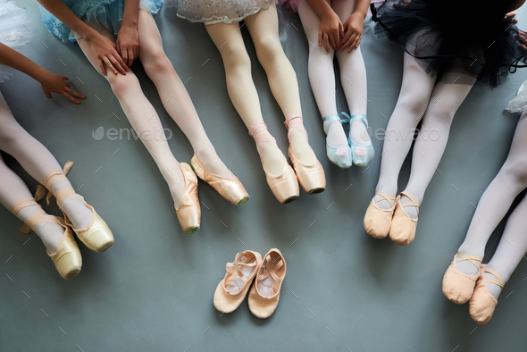 Six ballerinas on the floor, top view.