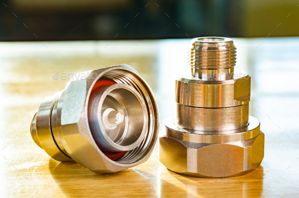 High frequency connectors component with a shiny copper nickel plating covering - Stock Photo - Images