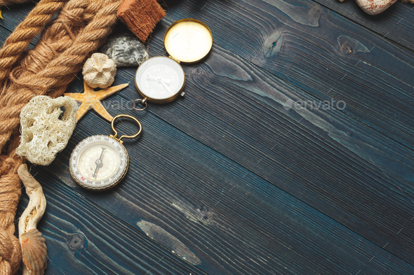 Nautical background. Sailing rope with a compass Stock Photo by FabrikaPhoto