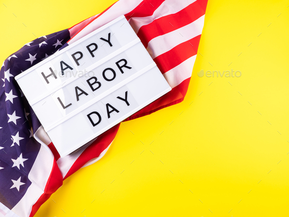 Happy Labor Day greetings on lightbox with american flag