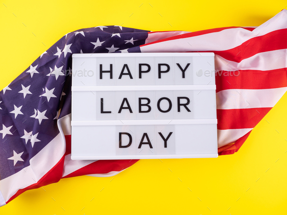 Happy Labor Day greetings on lightbox with american flag