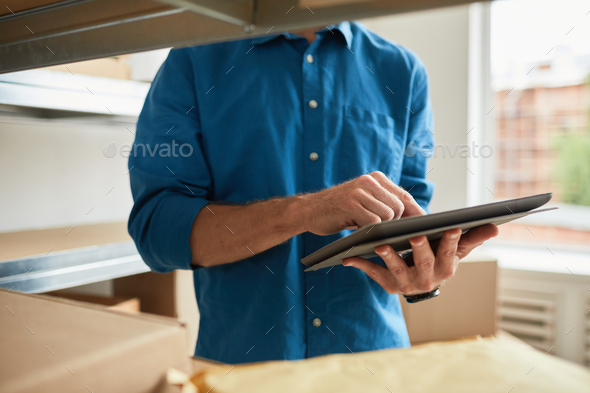 Man Managing Stock Inventory Close Up - Stock Photo - Images