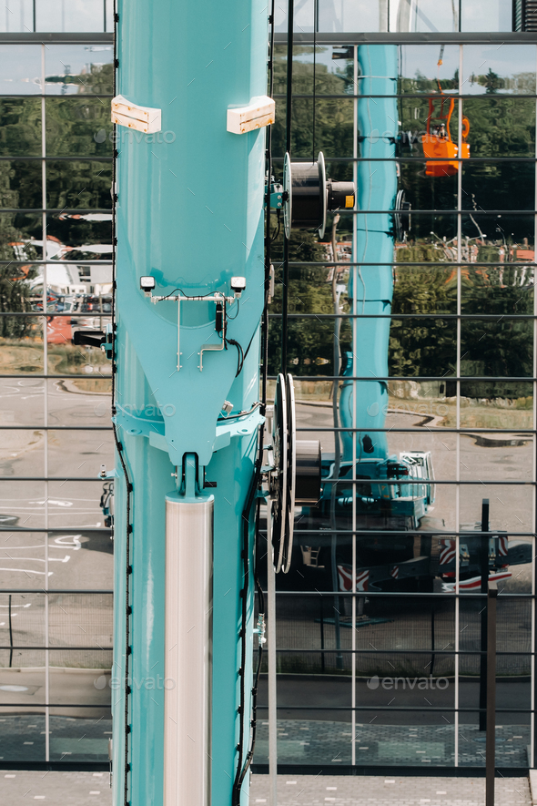 Hydraulic cylinder of the lifting system on a car crane.The control system of the crane engine