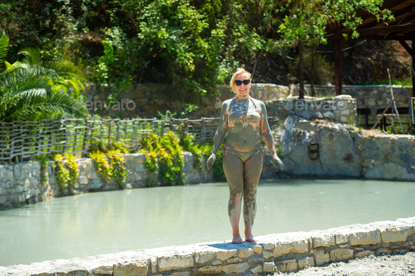 A girl takes a mud bath at a resort in Turkey.Health improvement in therapeutic mud