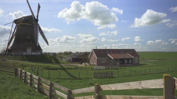 Vrouwgeestmolen Windmill During A Sunny Day In Alphen Aan Den Rijn, Netherlands. Panning Shot alt