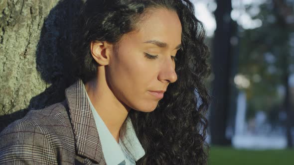 Side View Extreme Closeup Hispanic Beautiful Attractive Focused Young Girl Student Female Face with alt