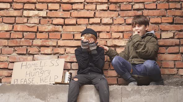 Homeless Kids Beggars on the Street with Social Message on the Cardboard Suffer From Poverty and alt