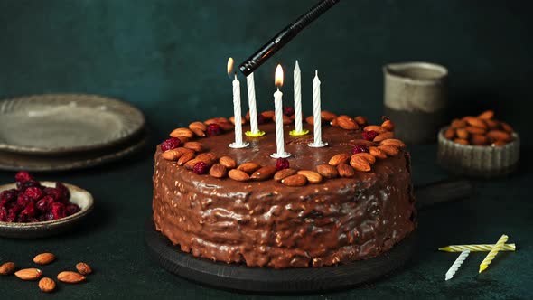 Chocolate birthday cake with candles. Party cake. Light candles. Make a wish. Happy birthday concept