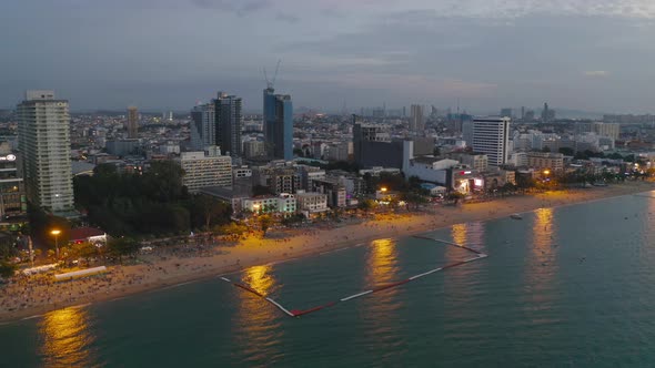 Aerial view of boats in Pattaya sea, beach in Thailand in summer season, with sunset sky alt