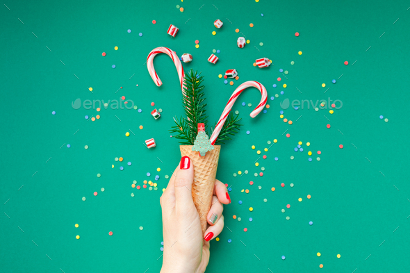 Christmas card with candy canes in waffle cone