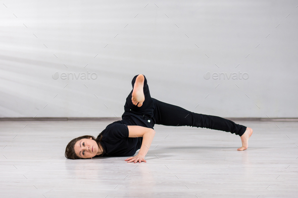 Girl dancer practicing dance element.