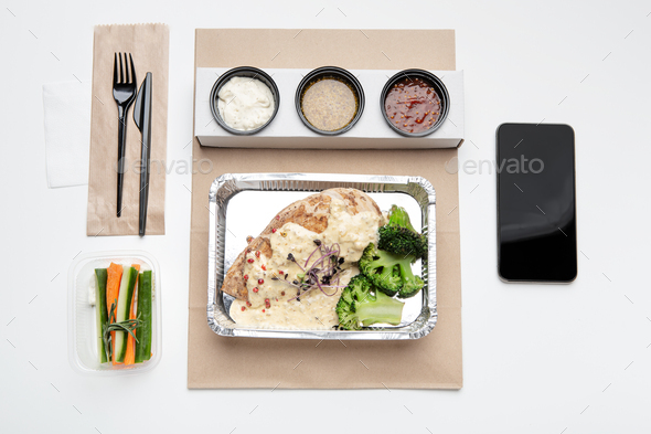 Restaurant menu ad, modern healthy food delivery service to home or office,  lunch for worker Stock Photo by Prostock-studio