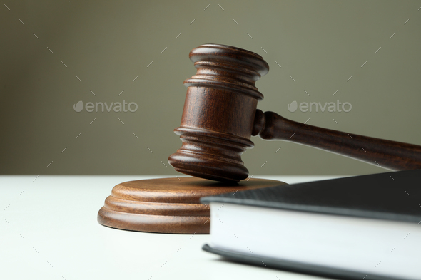 Judge gavel and law book on white table - Stock Photo - Images