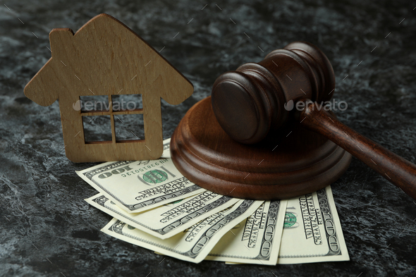 Judge gavel, dollars and wooden house on black smokey table - Stock Photo - Images