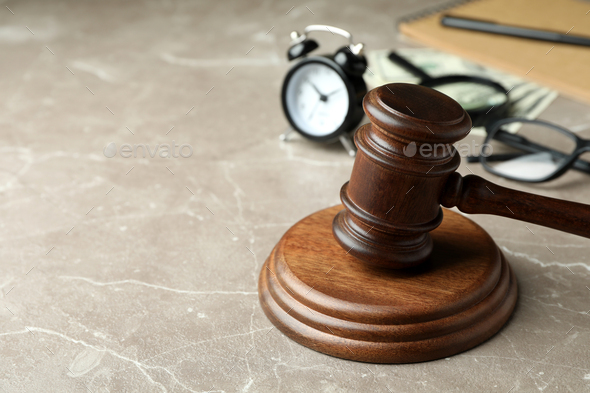 Law concept with judge gavel on gray textured table - Stock Photo - Images