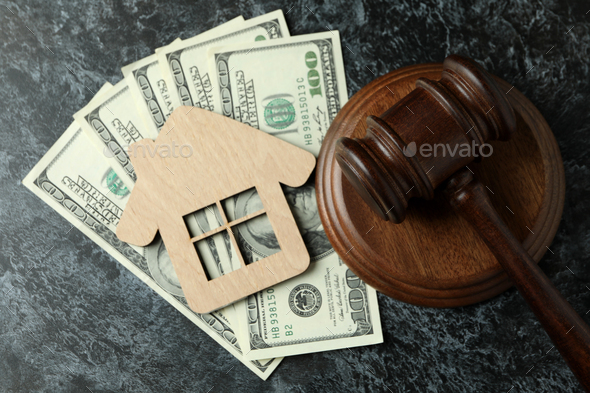 Judge gavel, dollars and wooden house on black smokey table - Stock Photo - Images