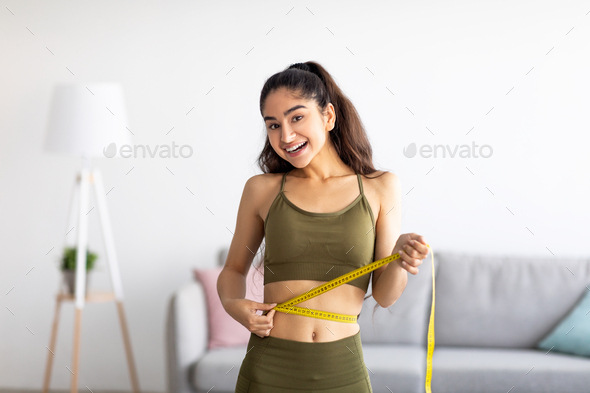 Woman with measuring tape. Weight loss concept. Woman take waist