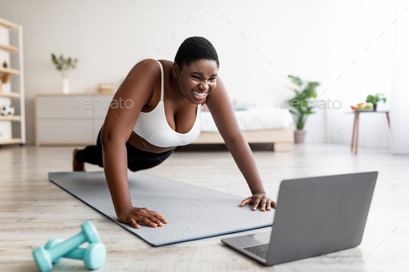 Woman Push-ups On The Floor At The Gym Stock Photo, Picture and