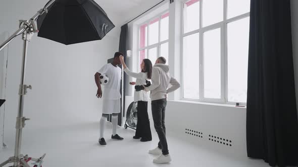 Art Director Checking the Photos on a Monitor alt