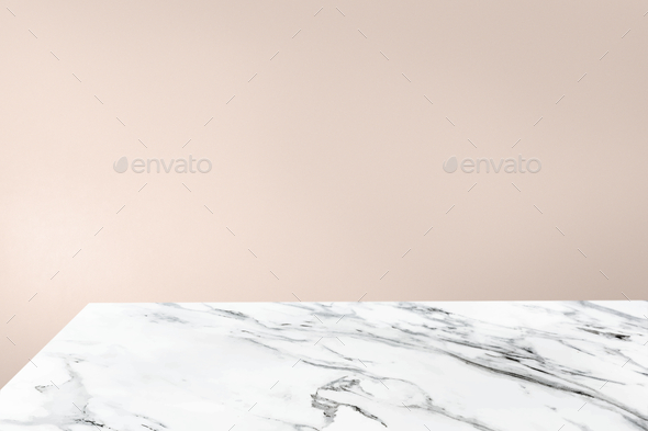 Copy space on white marble tabletop in beautiful pastel pink