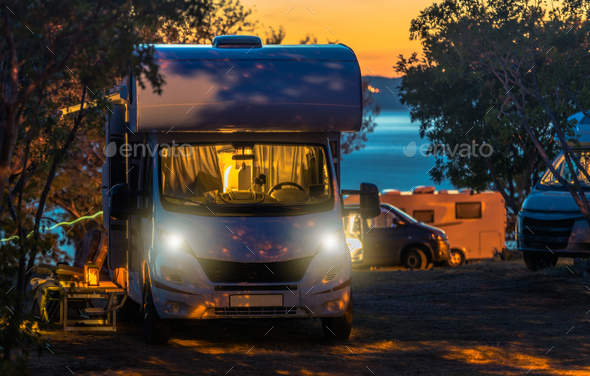 Scenic RV Park Campsite Sunset with Camper Vans