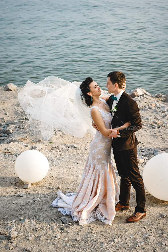 Ivory wedding 2024 dress with groom