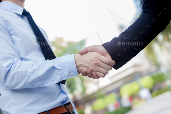Handshake between new employee with messy sleeves and boss - bad first impression concept