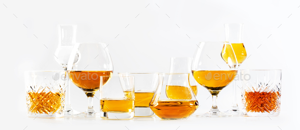 Strong alcohol drinks, hard liquors, spirits and distillates iset in glasses
