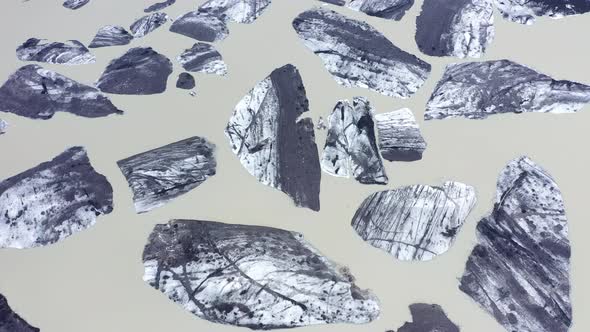 Flying Over Floating Icebergs From Melting Glacier in Iceland alt