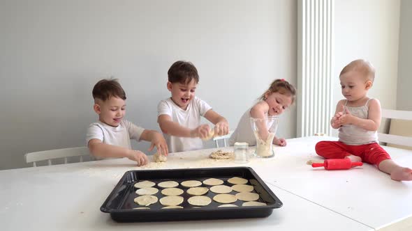 Family Concept, Four Children Help Their Mother Bake Cookies, Pizza Buns