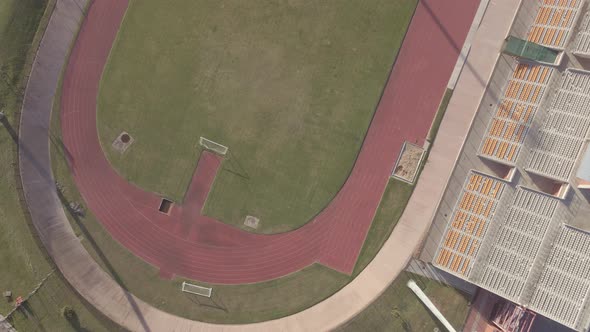 Drone View Flying Over Track and Field Shot From Directly Above