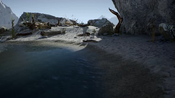 White Sand Beach Near Rocky Cliffs at Ocean alt