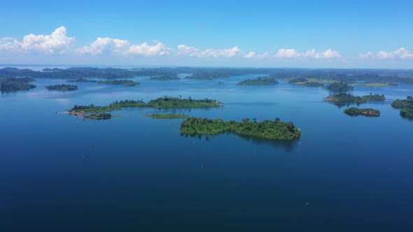 Drone Flies Over A Large Blue Lagoon, With Islands Full Of Green Trees, Paradise In Brazil