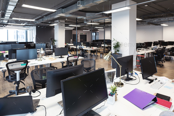 Interior of modern office with chairs at desk stock photo