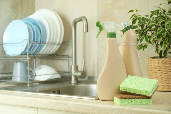 Concept of Dishwashing detergent accessories on kitchen background Stock  Photo - Alamy