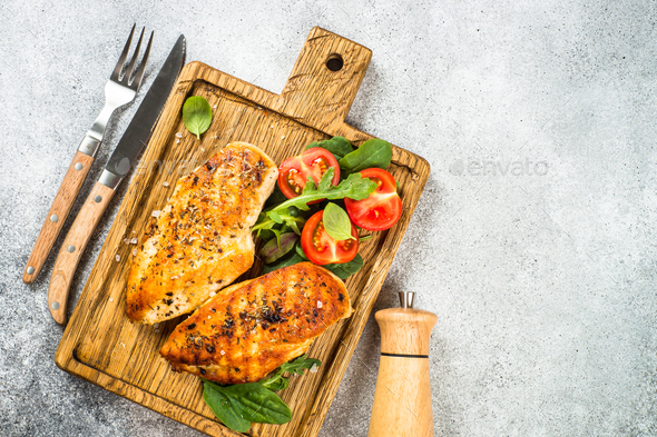 Grilled Chicken Fillet On Wooden Cutting Board Stock Photo, Picture and  Royalty Free Image. Image 45560187.