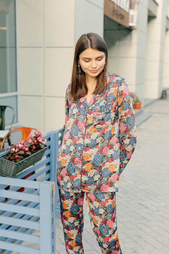 Portrait of pretty girl in fashion trendy colorful pajamas. Business center  Stock Photo by slavamishura