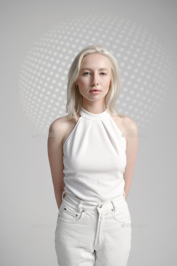 Futuristic young woman in white clothes - Stock Photo - Images