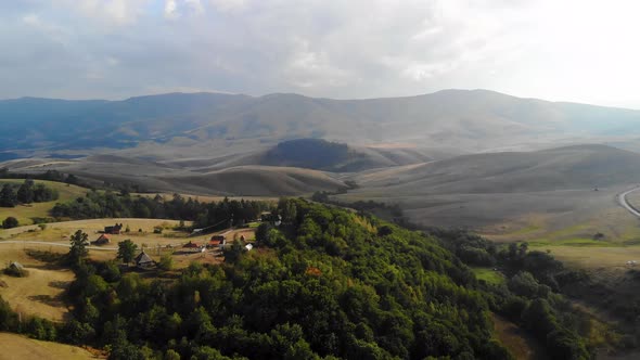 Aerial View of Green Hills of Pester Plateau Mountain Region in Western Serbia on Summer Day Drone