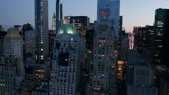 AERIAL: Manhattan Skyline at Night with Flashing City Lights in New York City at Central Park  alt