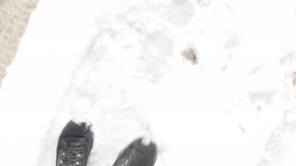 Walking  scene with legs in high snow POV 3840X2160 UHD video - Hiker walks in waterproof boots 4K 2