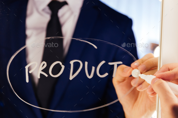 Smart business man writing the word Product on the mirror board - Product text. - Stock Photo - Images