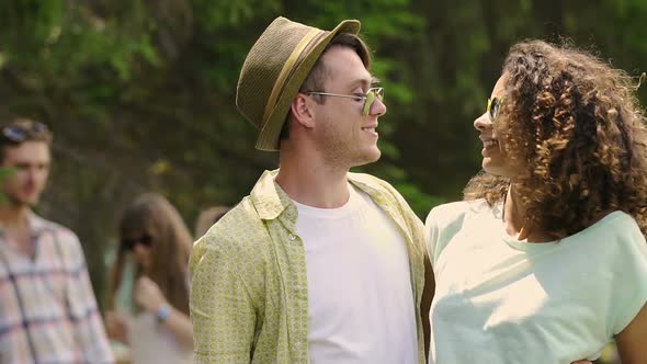 Smiling Man and Woman Making Funny Faces, Pouting for Selfie on Smartphone alt