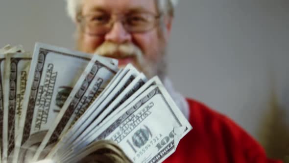 Santa claus fanning currency notes alt