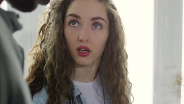 Young Brunette Talking to Colleagues alt