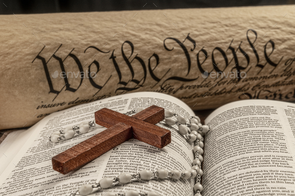 Holy bible and small cross with the constitution - Stock Photo - Images