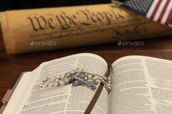 Holy bible and small cross with the constitution - Stock Photo - Images